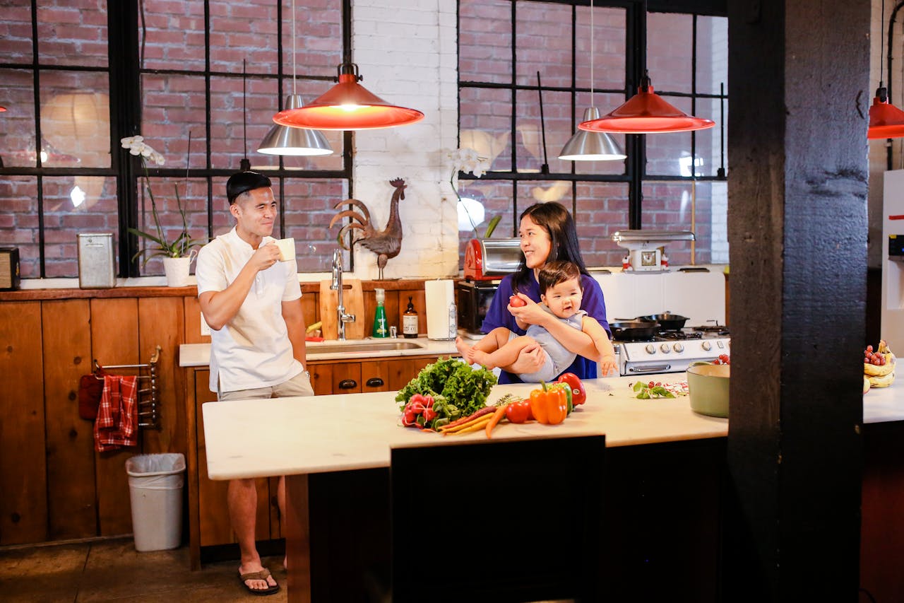 East Asian family cooking together, enjoying quality time in a warm, inviting kitchen setting.