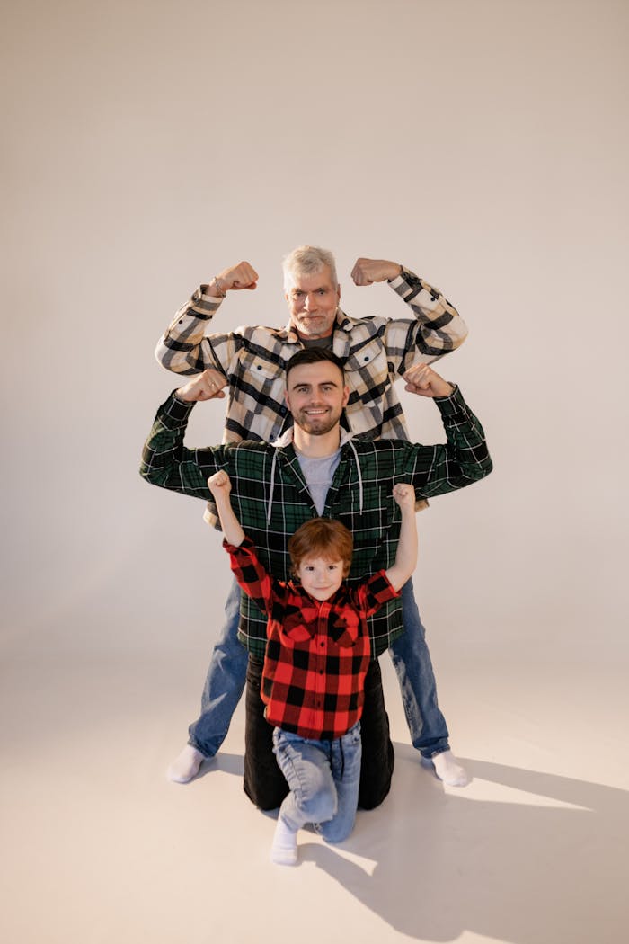 Portrait of three generations showing strength and unity in a studio setting.